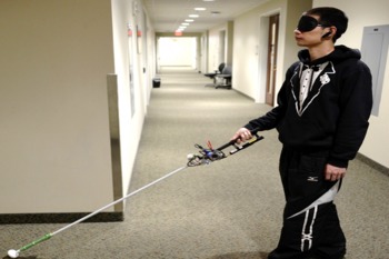 Picture Of Man Using Robotic White Cane